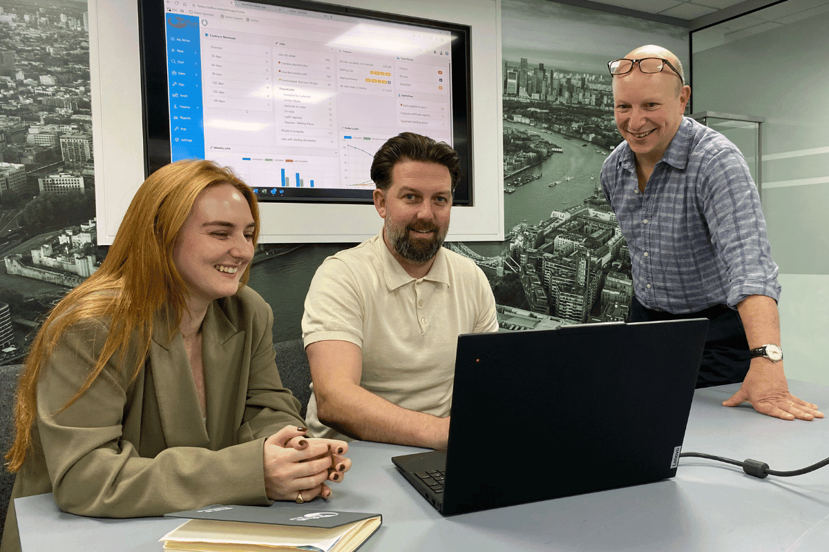 TeamPoint team reviewing the software with a customer to improve efficiency and reduce administration.